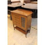 Music Cabinet An Edwardian mahogany and satinwood banded music cabinet on slender turned and
