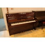 Bechstein (c1983) A Model 12N upright piano in a modern style bright mahogany case.