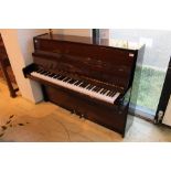 Blüthner (c1983) A Model 110 upright piano in a modern style bright mahogany case.