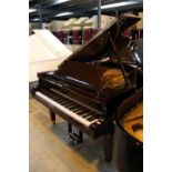 Schimmel (c1986) A 5ft 8in Model 174T grand piano in a bright mahogany case on square tapered legs.