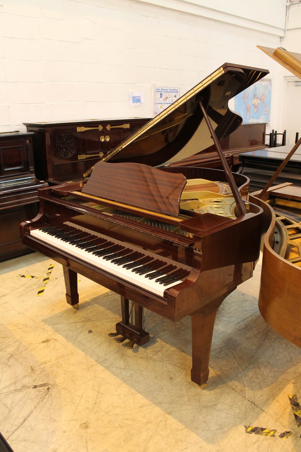 Yamaha (c1989) A 5ft 7in Model G2RE grand piano in a bright mahogany case on square tapered legs;