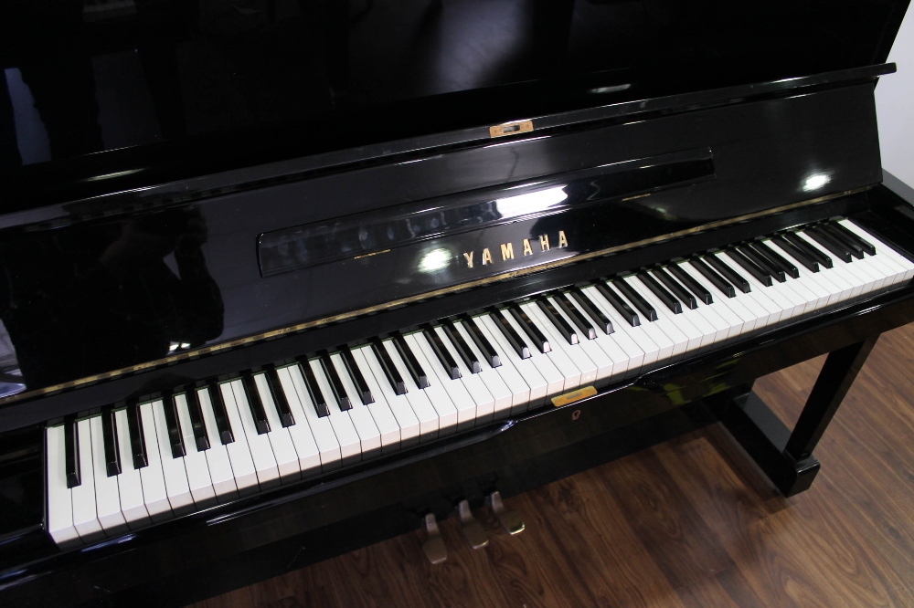 Yamaha (c1976) A Model U1 upright piano in a bright ebonised case. - Image 2 of 4