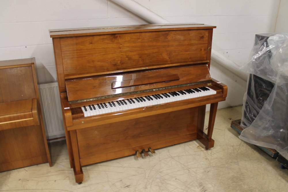 Offenbach (c1988) A 130cm upright piano in a bright mahogany case. AMENDMENT Is in a walnut case.