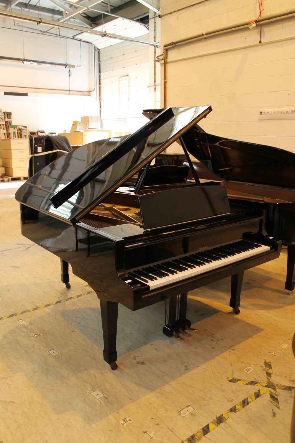 Weinbach (c1991) A 6ft 4in grand piano in a bright ebonised case on square tapered legs.