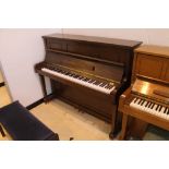 Woodchester (c1997) A Concerto Schubert Model upright piano in a satin mahogany case;