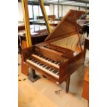 Morley Double Manual Harpsichord A double manual harpsichord in a walnut crossbanded and flame