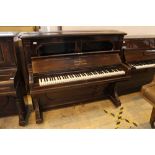 Steinway (c1892) An upright piano in a rosewood case; together with a stool.