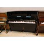 Petrof (c2015) A Model 118 upright piano in a bright ebonised case.