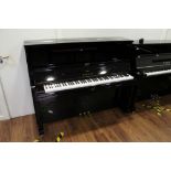 Yamaha (c2014) A Model SE122 upright piano in a bright ebonised case; fitted with a silent system.