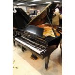 Yamaha (c1991) A 6ft 1in Model C3 grand piano in a bright ebonised case on square tapered legs.