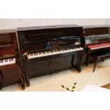 Welmar (c1939) An upright piano in a traditional mahogany case; together with a stool.