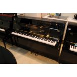 Yamaha (c2000) A Model E108 upright piano in a bright ebonised case: together with an adjustable