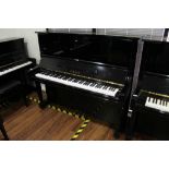 Yamaha (c1985) A Model U3 upright piano in a bright ebonised case;