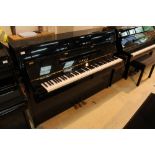 Yamaha (c2004) A Model C109 upright piano in a bright ebonised case;