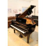 Yamaha (c2010) A 5ft 3in Model C1 grand piano in a bright ebonised case on square tapered legs;