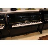 Yamaha (c1991) A Model M108 upright piano in a modern style satin mahogany case.