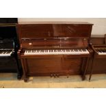 Welmar (c1998) An upright piano in a traditional bright mahogany case; together with a stool.