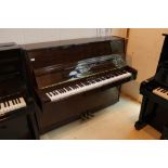 Pearl River (c2001) A Model UP 114D upright piano in a bright mahogany case;