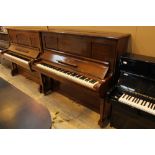 Steinway (c1928) A Model K upright piano in a rosewood case.