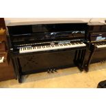 Kemble A recent Model K113 upright piano in a bright ebonised case; fitted with a silent system.