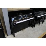 Brodmann (c2020) A 122cm upright piano in a bright ebonised traditional case; together with a