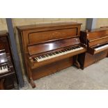 Steinway (c1907) An upright piano in an inlaid rosewood case.