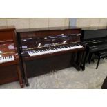 Yamaha (c2000) A Model 114N upright piano in a traditional bright mahogany case; together with a