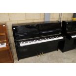 Petrof (c2000) A Model 100 upright piano in a bright ebonised modern style case; together with a