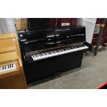 Yamaha (c2005) A Model C110A upright piano in a modern style bright ebonised case; together with a