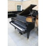 Schimmel (c1988) A 7ft grand piano in a satin black ash case on square tapered legs.