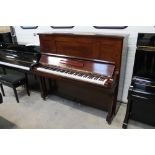 Steinway (c1923) A Model K upright piano in a satin mahogany case.