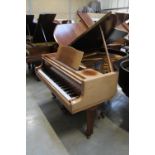 Blüthner (c1979) A 6ft 3in grand piano in a bright walnut case on square tapered legs.