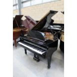 Steinway (c1958) A 5ft 7in Model M grand piano in a bright ebonised case on square tapered legs;