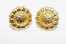 A pair of Italian yellow metal stud earrings, in the shape of sunflowers, 14mm diameter,