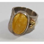 A modern silver and amber dress ring, London 2010, maker's mark IMV,