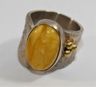 A modern silver and amber dress ring, London 2010, maker's mark IMV,