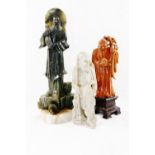 A Chinese carved soapstone figure of Shoulao, the Chinese god of longevity, on carved plinth,