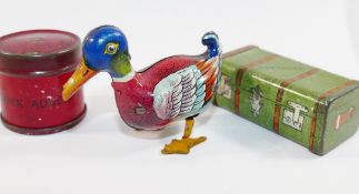 A small tin plate clockwork duck, stamped 'Made in US zone Germany', 7cm long, with key,