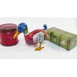 A small tin plate clockwork duck, stamped 'Made in US zone Germany', 7cm long, with key,