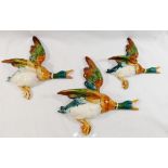 A set of three Beswick graduated wall mounted flying ducks, with impressed marks 596-1,