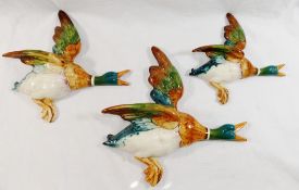 A set of three Beswick graduated wall mounted flying ducks, with impressed marks 596-1,