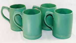 A set of four green glazed Wedgwood tankards by Keith Murray, 2.