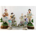 A pair of West German porcelain figures by Martha Budich of a shepherdess and a pipe player,