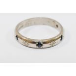 An 18 carat white gold sapphire and diamond half eternity ring, Birmingham 1997,