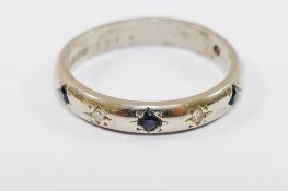 An 18 carat white gold sapphire and diamond half eternity ring, Birmingham 1997,