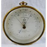 An Air Ministry Met Office brass cased compensated hanging aneroid barometer by J Hicks of Hatton