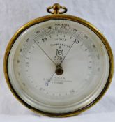 An Air Ministry Met Office brass cased compensated hanging aneroid barometer by J Hicks of Hatton