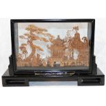 A 20th century Chinese carved cork landscape diorama, depicting trees, a pagoda and cranes,