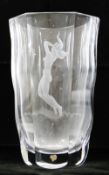 An Orrefors clear glass vase by Edvin Ohrstrom, with panelled and wavy sides,