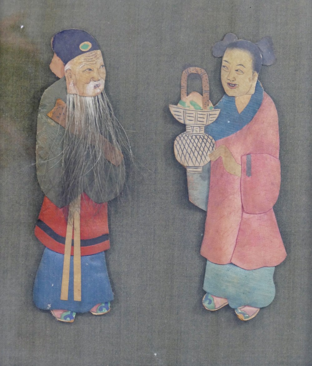 An early 20th century Chinese fabric covered panel mounted in relief with a pair of painted fabric, - Image 2 of 2